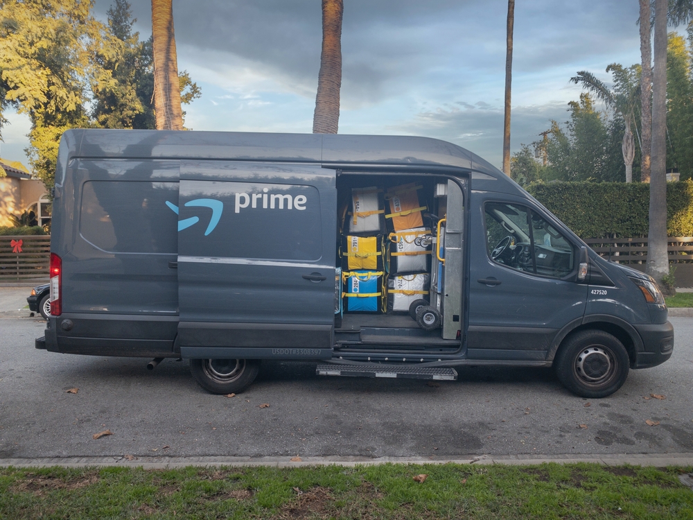Amazon Delivery Truck parked outside a residential home