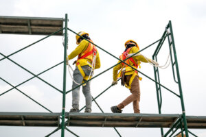 Workers in safety gear on Scaffolding