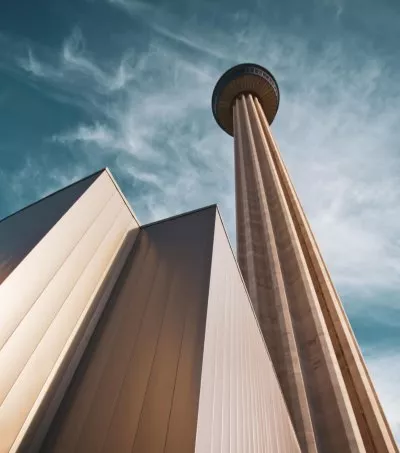 Skyward view of tall building from below