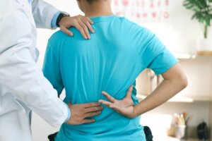 Man seeks treatment from a doctor for chronic back pain