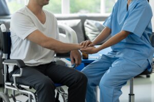 Man receives physical therapy treatment after major injury