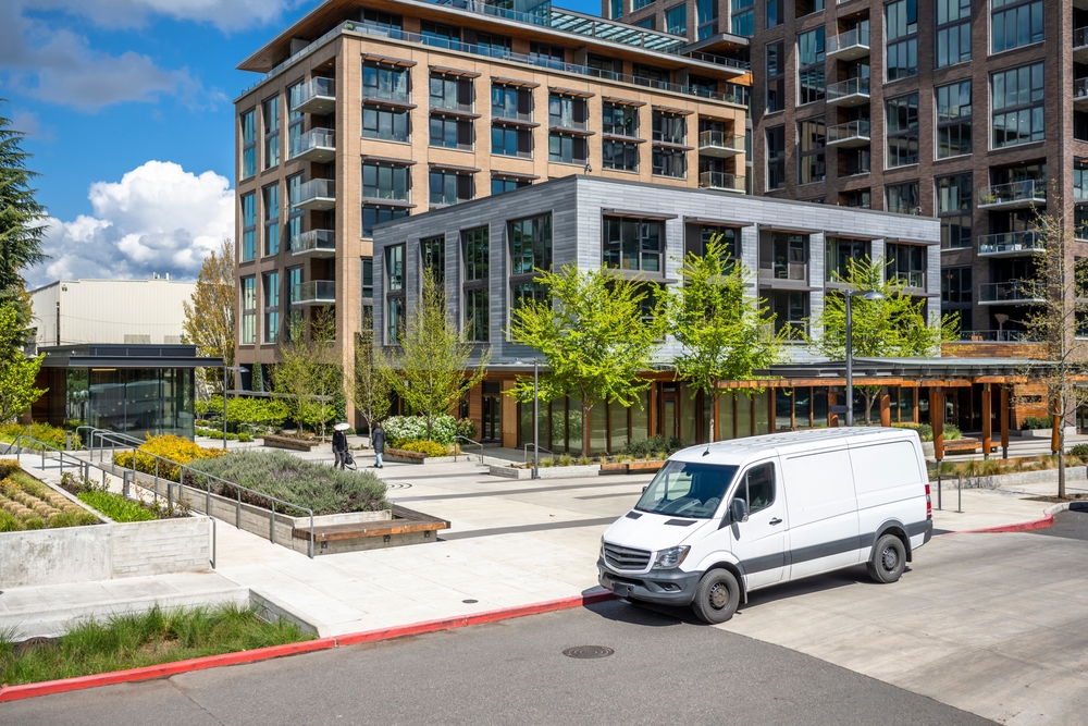 Rental van parked outside apartment building