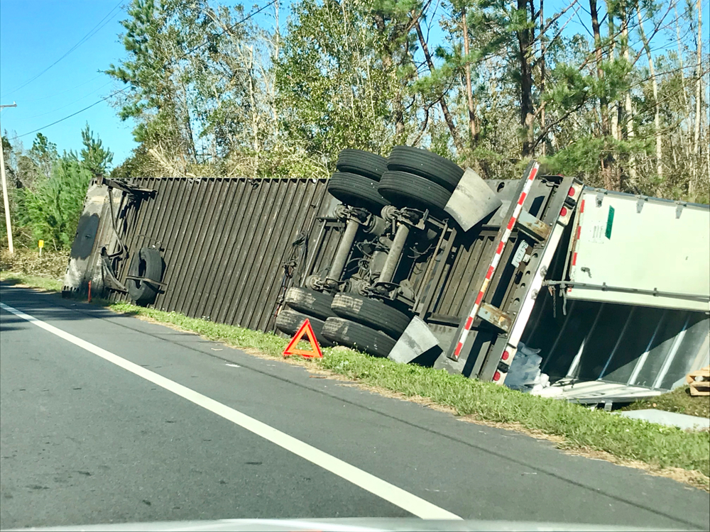 Tipover truck accident on side of interstate
